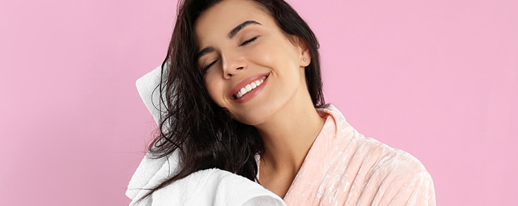 Woman drying herself with towel