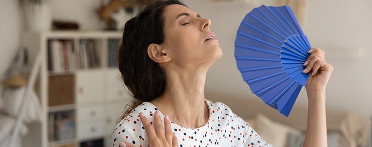 Woman fanning herself