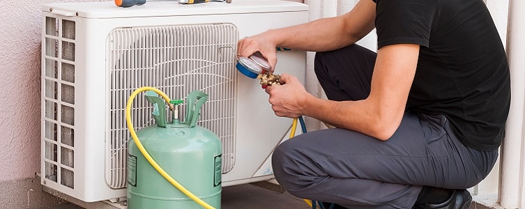 Man Installing Mini Split Condensor