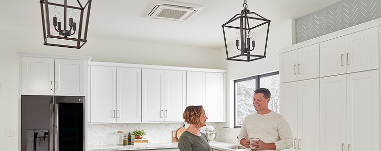 Couple in Kitchen with ceiling cassette mini split